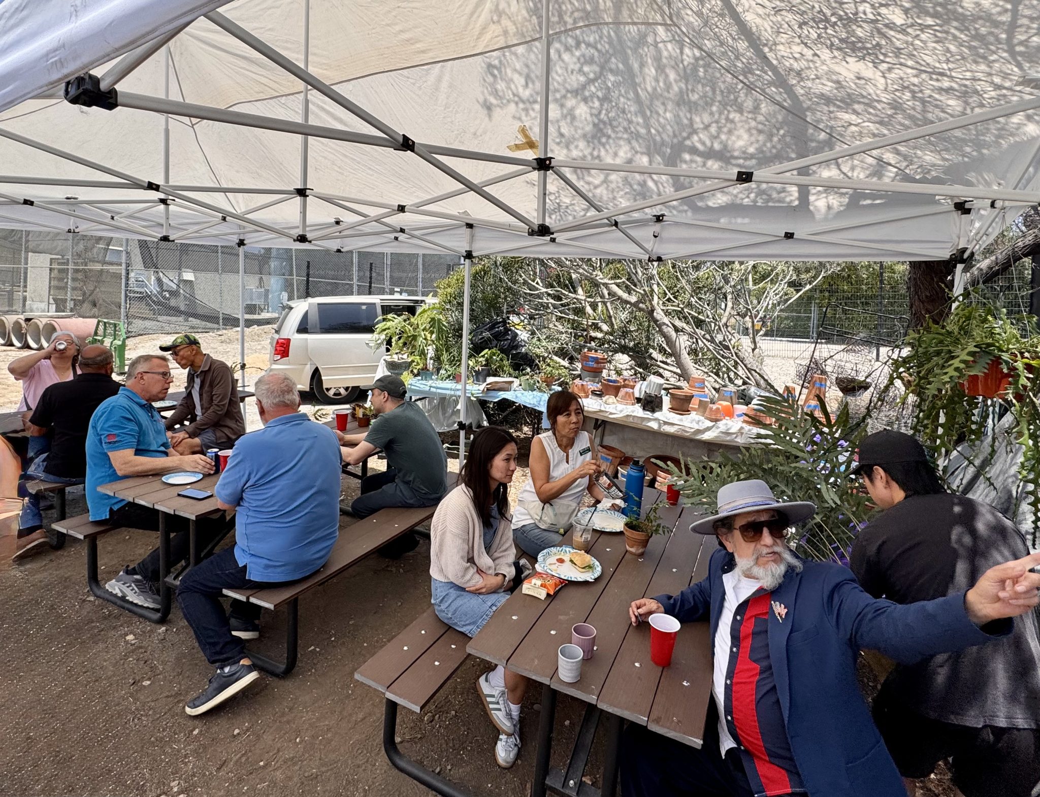 Members sharing lunch at the grow area picnic