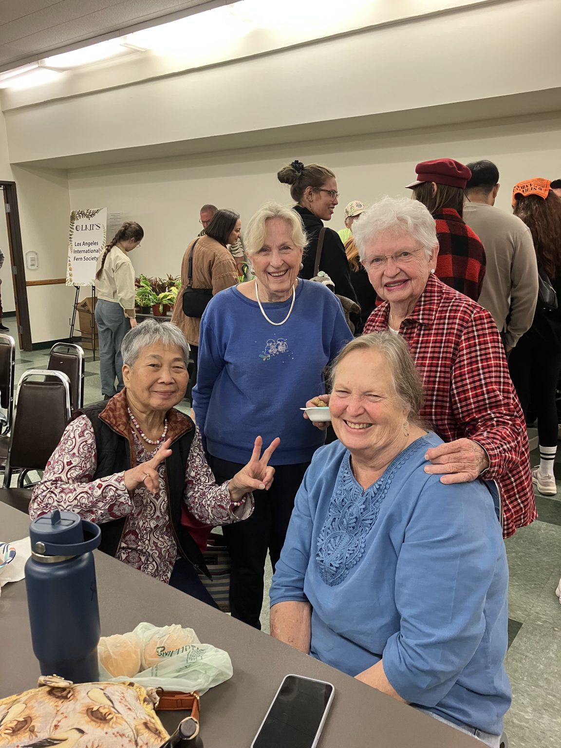 Members laughing together at a meeting